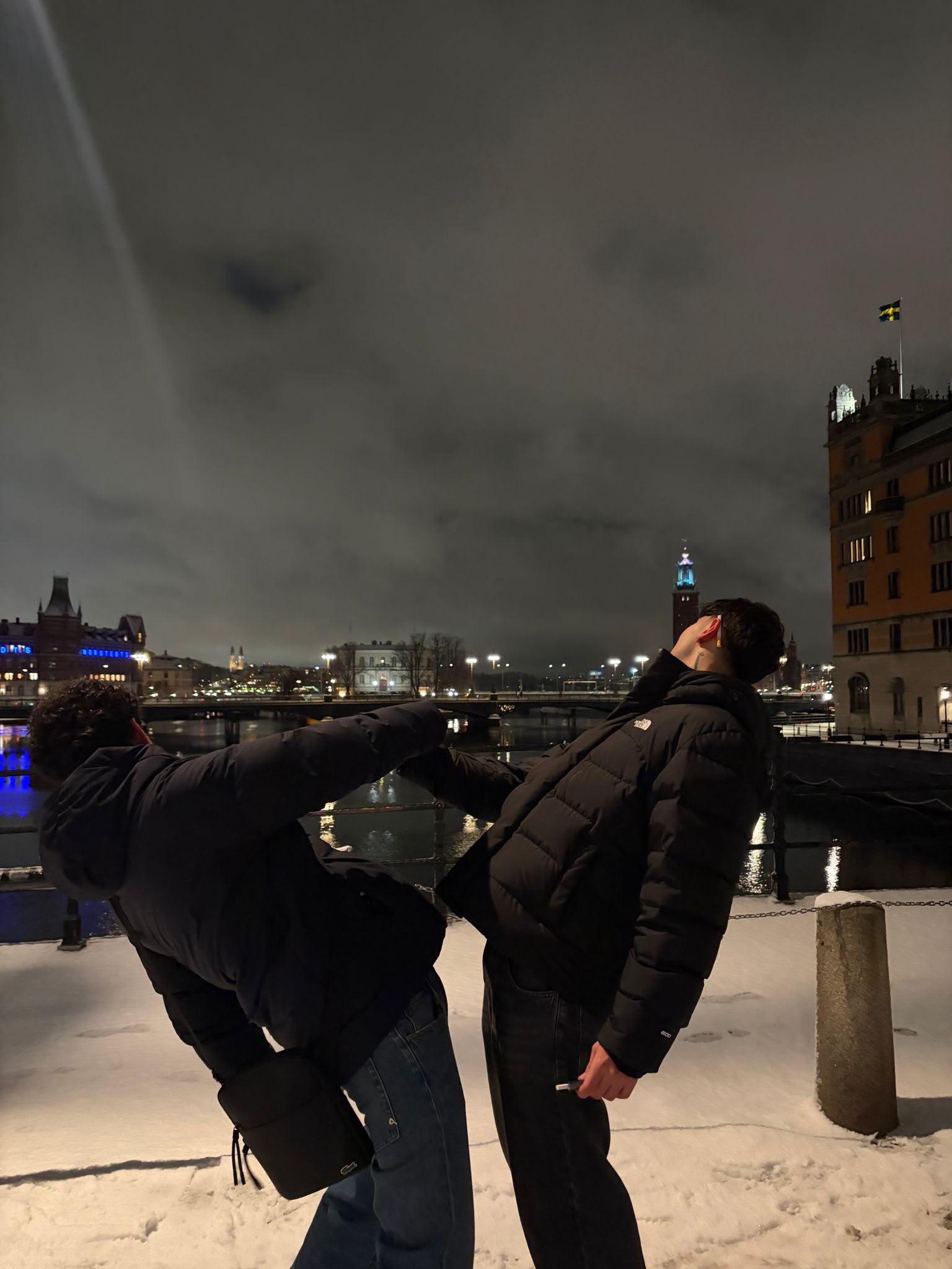 The two of us goofing around in the snow by the water